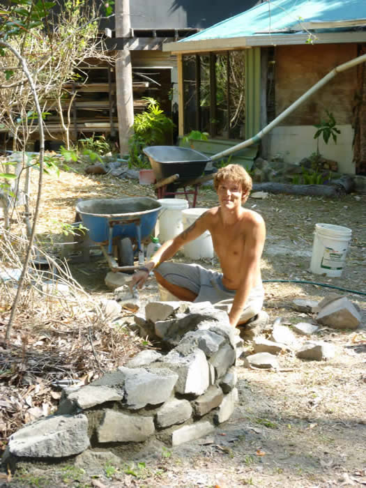 Freddie building a stone garden retaining wall