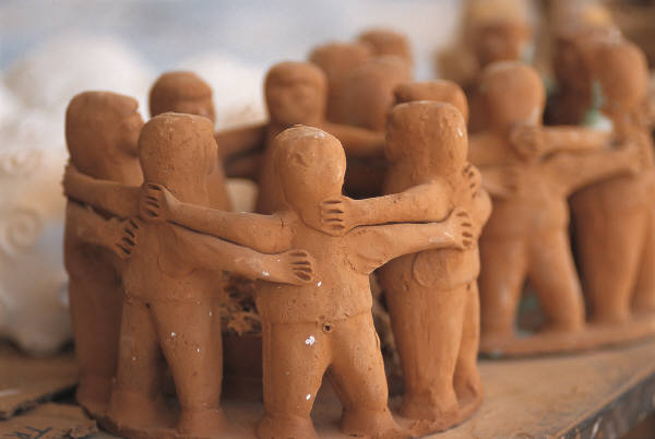Clay Figurines people arm in arm in circle